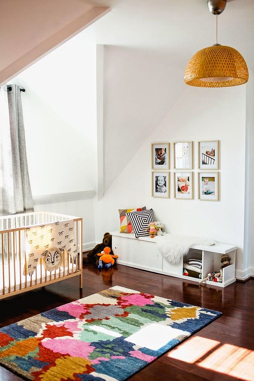 A patchwork of colors for the rug works well in any neutral modern nursery